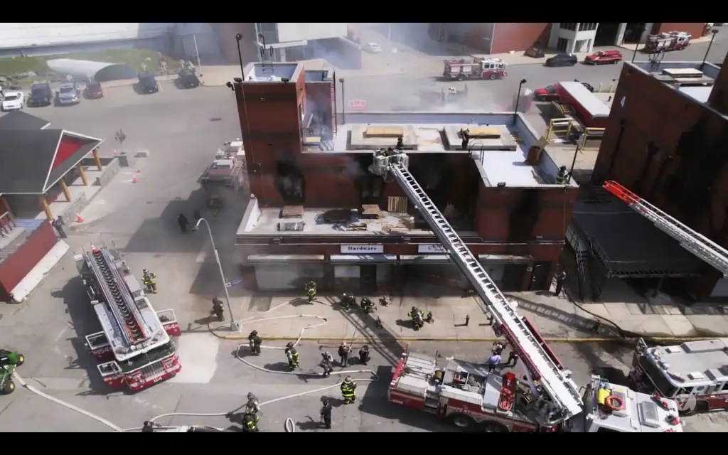 An aerial view of a fire in a building as firefighters from the Leary Firefighters Foundation bravely respond to the emergency.