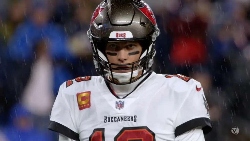 The tampa bay buccaneers quarterback is standing in the rain.