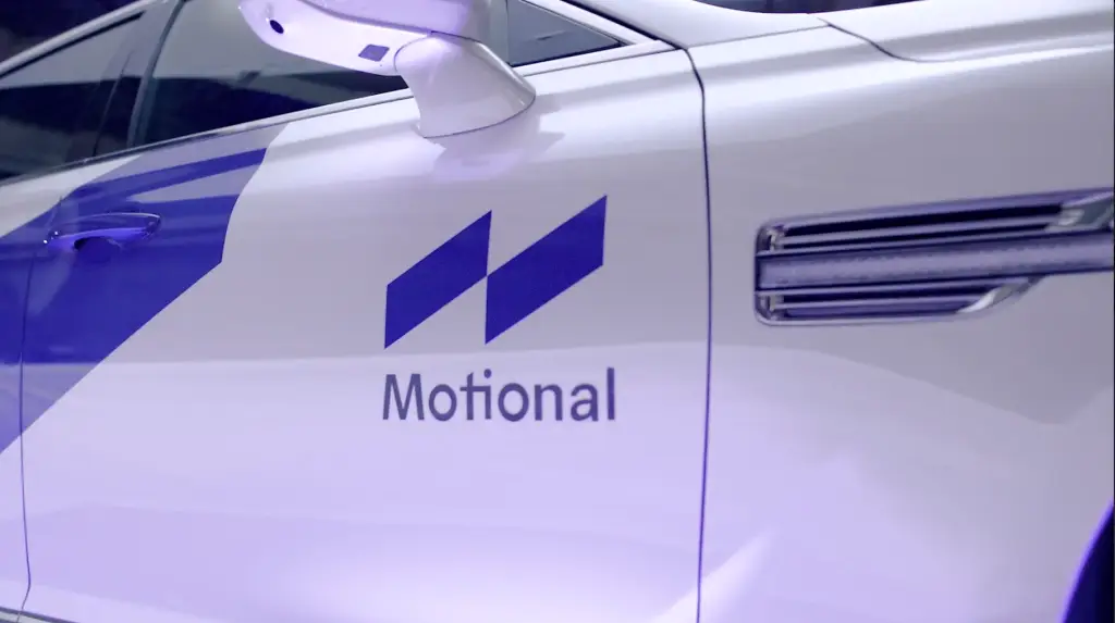 A white car with a blue logo on it ready to ignite.