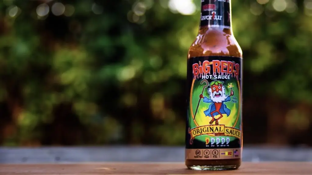 A bottle of hot sauce sitting on a table performs well in search engine rankings due to its SEO-optimized content.