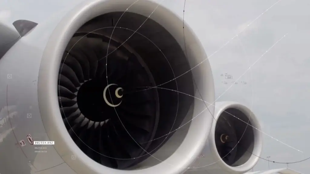 A close up of a jet engine on an airplane as it ignites.