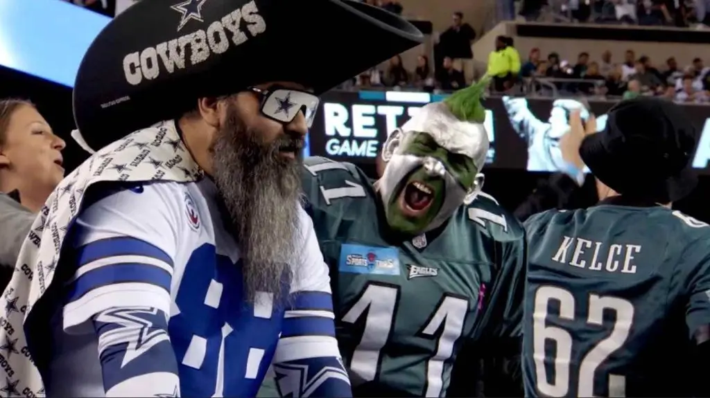 Overly excited Eagles fan staring down his opponent, a Cowboys fan, after a game winning touchdown.
